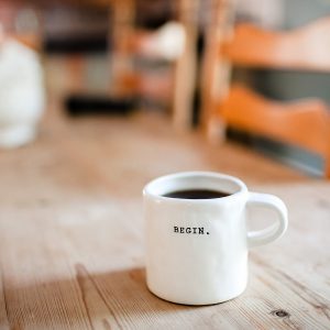 Coffee mug with the words "Begin"