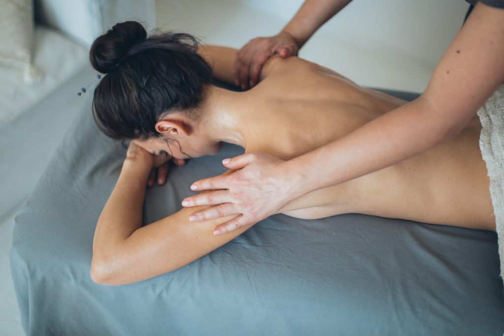 woman receiving a back massage