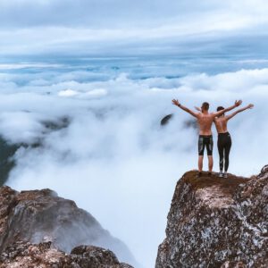 two people on top of mountain