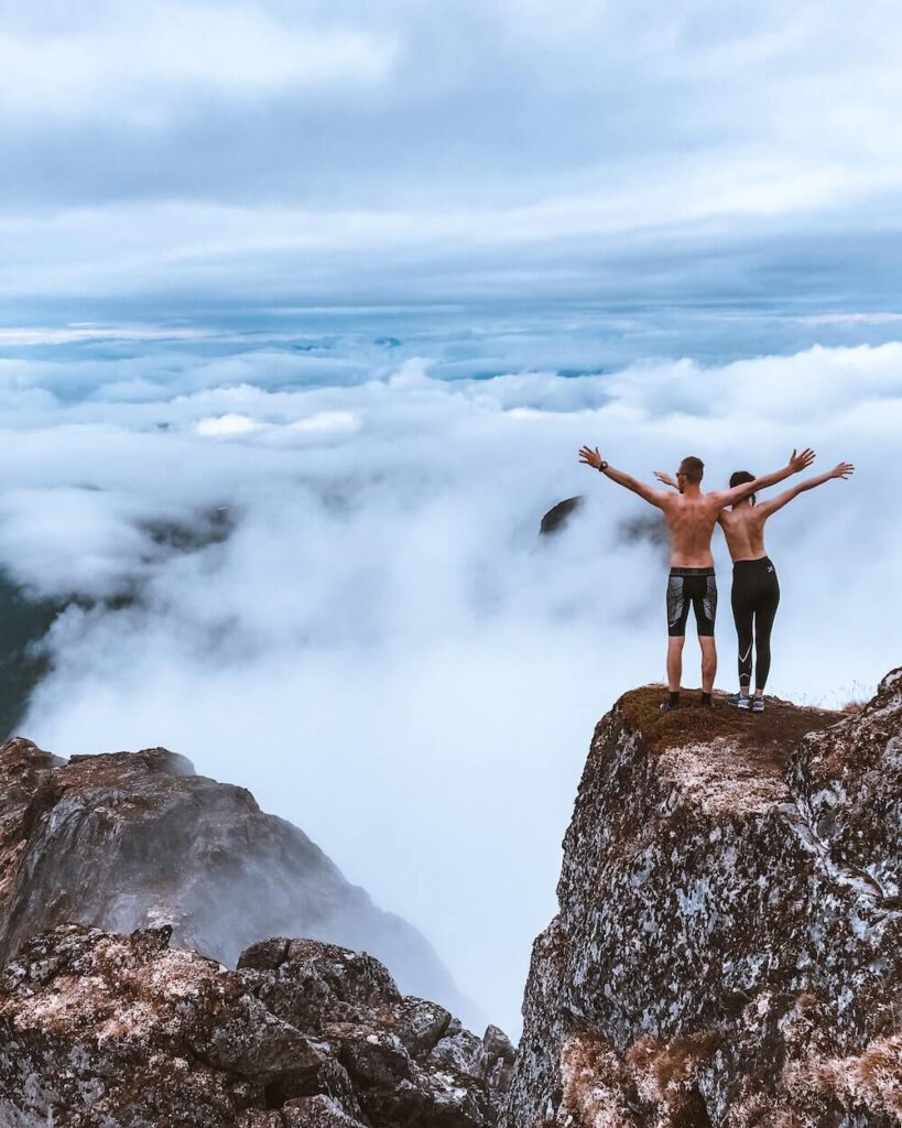 two people on top of mountain